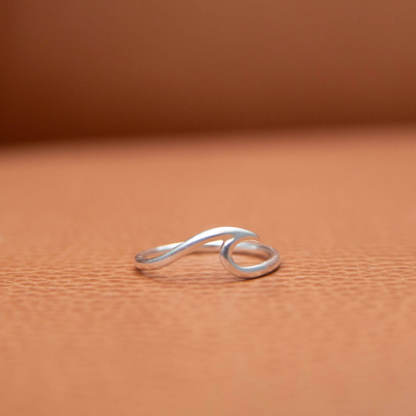 Sterling Silver Wave Ring on a leather background
