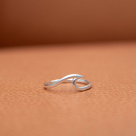 Sterling Silver Wave Ring on a leather background