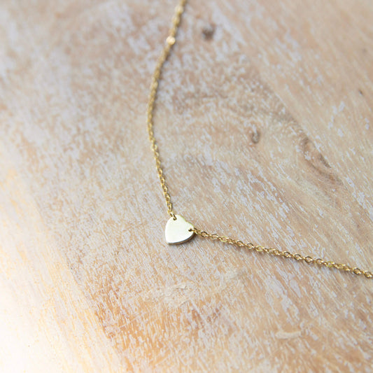 gold necklace with a small love heart pendant
