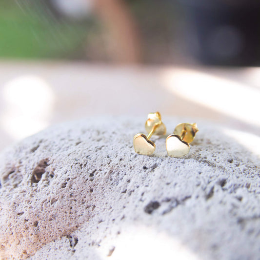 gold plated love heart stud earrings close-up