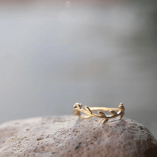 Gold Plated Wreath Ring close-up on a rock