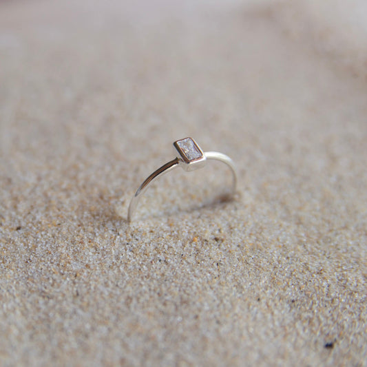 Sterling silver stone ring on sand