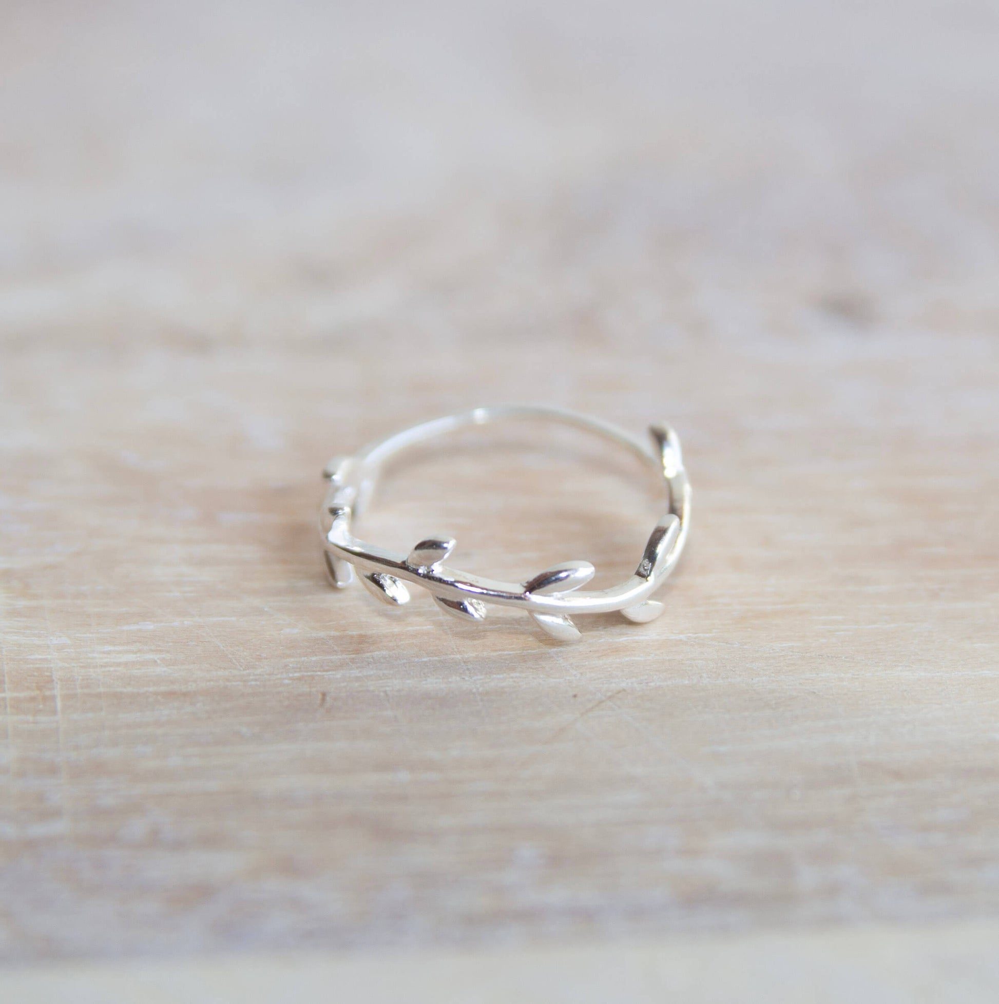 Sterling Silver Wreath Ring on a wooden table