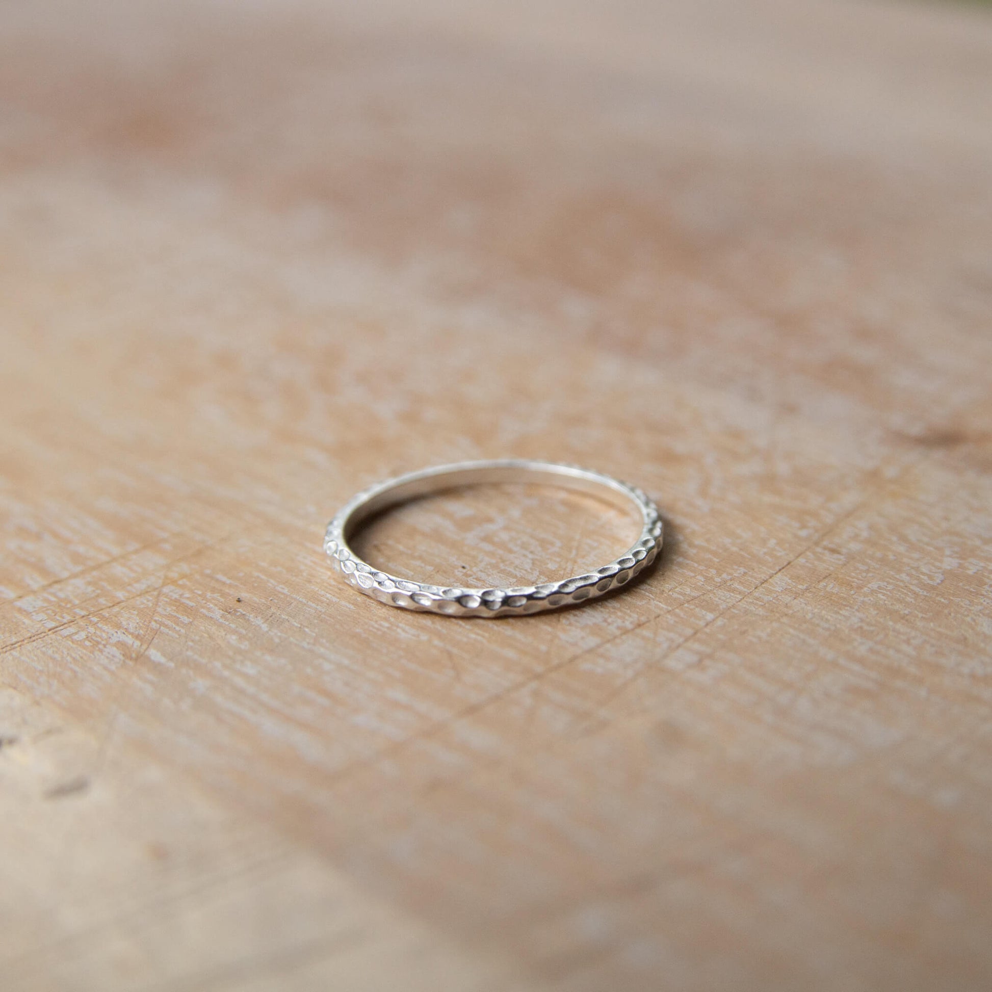Sterling Silver Hammered Ring on a table