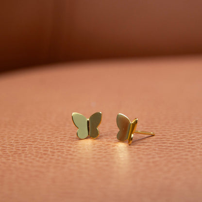 Gold Plated Butterfly Stud Earrings placed on table