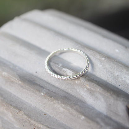 Sterling Silver Hammered Ring on concrete