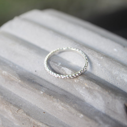 Sterling Silver Hammered Ring on concrete