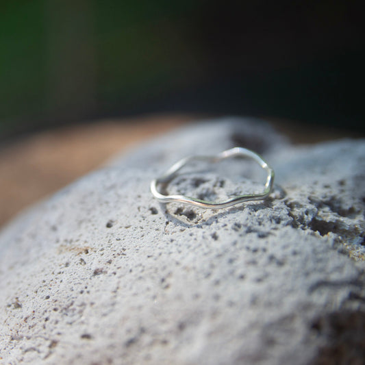 Sterling Silver Ripple Ring on a rock