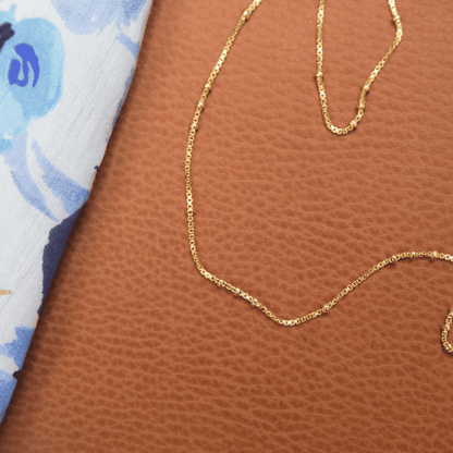 Gold Plated Chain placed on leather