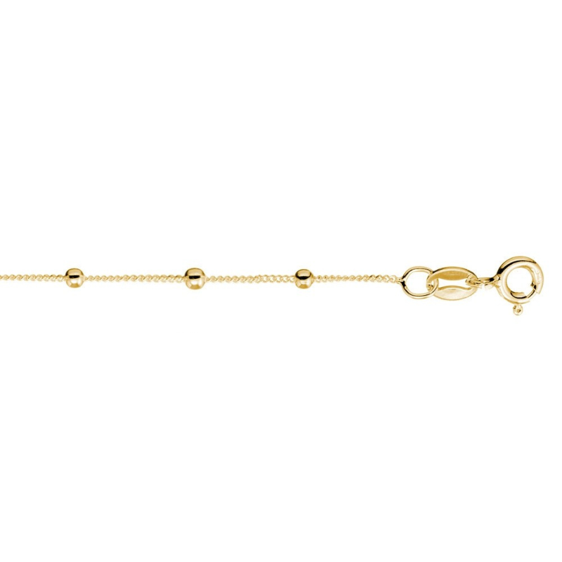 Gold bracelet with small beads on a white background