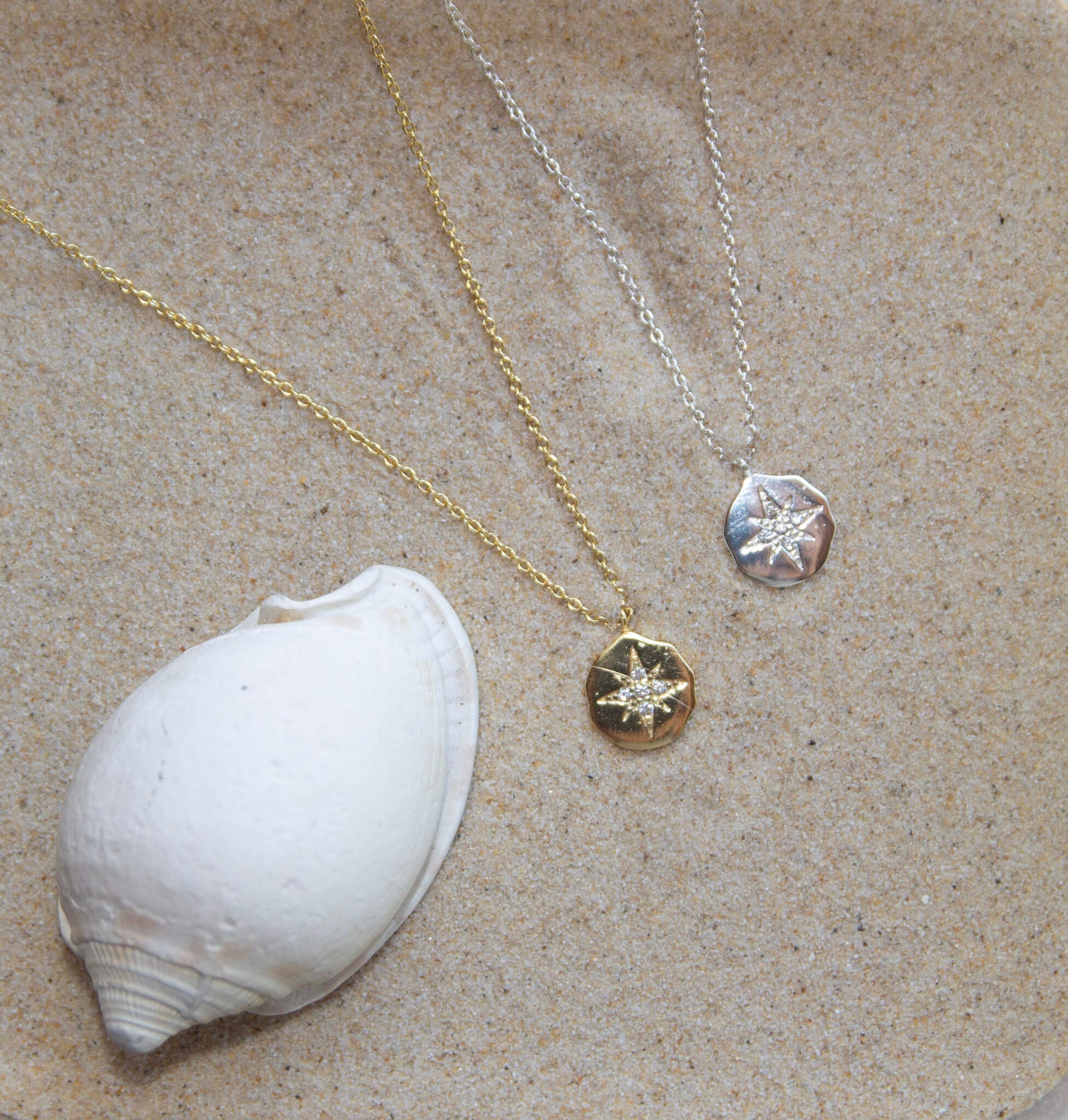 Sterling Silver Pendant Necklaces on sand