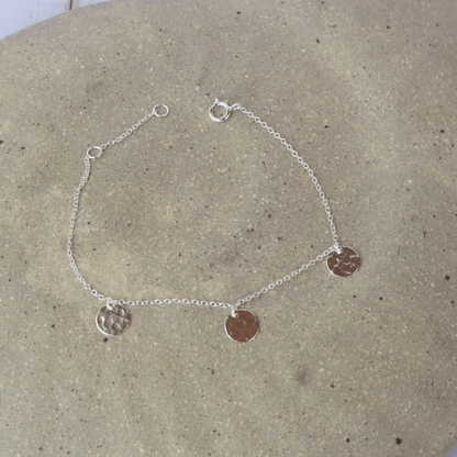 silver bracelet with hammered discs 