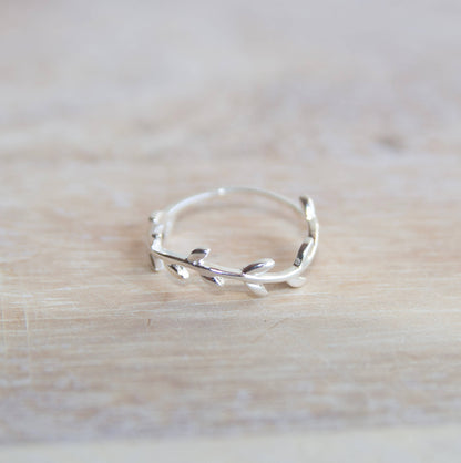 Sterling Silver Wreath Ring on a wooden table